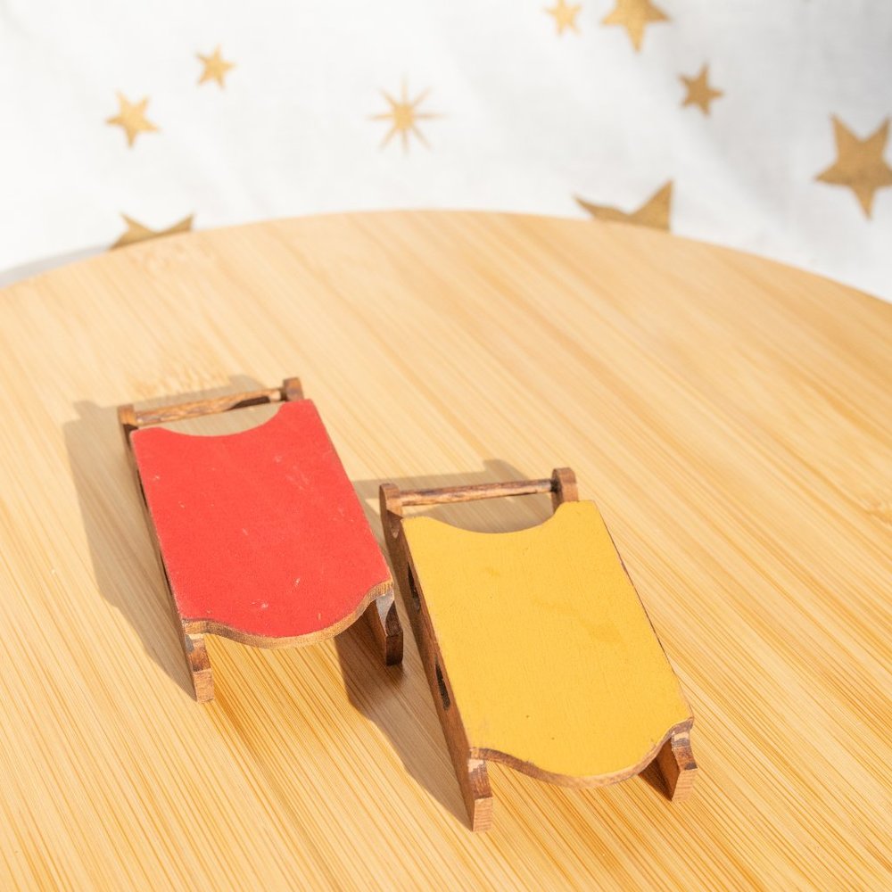Set of two vintage sled ornaments